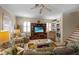 Relaxing living room featuring comfortable seating and a large TV at 220 82Nd St, Holmes Beach, FL 34217