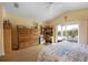 Bright main bedroom with king-size bed, and built-in dresser at 220 82Nd St, Holmes Beach, FL 34217