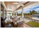 Relaxing screened porch overlooking the neighborhood at 220 82Nd St, Holmes Beach, FL 34217