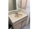 Modest bathroom shows marbled vanity countertop with a sink, neutral walls, and cabinet storage underneath the sink at 22389 Elmira Blvd, Port Charlotte, FL 33952