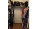 Walk in closet with shelving, hanging rack and wood floors at 22389 Elmira Blvd, Port Charlotte, FL 33952