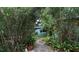 Landscaped backyard with stone path at 2311 Roselawn Cir, Sarasota, FL 34231