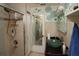 Bathroom with glass sink and walk-in shower at 2311 Roselawn Cir, Sarasota, FL 34231