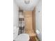 Bathroom with shower/tub combo and wood-look floors at 2329 Outer Dr, Sarasota, FL 34231