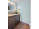 Bathroom with dark brown vanity and tiled floors at 2329 Outer Dr, Sarasota, FL 34231