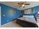 Primary bedroom with king bed and dark blue walls at 2566 Forest Run Ct, Clearwater, FL 33761