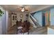 Dining room with dark wood table, staircase, and light walls at 2566 Forest Run Ct, Clearwater, FL 33761