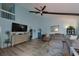 Living room with high ceilings, L-shaped sofa, and a loft at 2566 Forest Run Ct, Clearwater, FL 33761