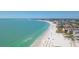 Aerial view of beach coastline, showing clear water, sandy beach, and beachfront properties at 2743 Fountain Pl, Sarasota, FL 34235