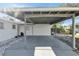 Covered carport with concrete parking area at 2743 Fountain Pl, Sarasota, FL 34235