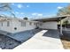 White single-story house with carport and gravel landscaping at 2743 Fountain Pl, Sarasota, FL 34235