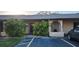 Condo exterior with parking and tropical landscaping at 2808 60Th W Ave # 403, Bradenton, FL 34207