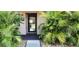 Inviting condo entrance with lush tropical landscaping at 2808 60Th W Ave # 403, Bradenton, FL 34207