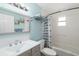 Clean bathroom with gray vanity and shower/tub at 3200 Tobero Ln, Sarasota, FL 34235