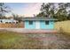 Cute light blue bungalow with a fenced yard at 3200 Tobero Ln, Sarasota, FL 34235