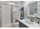 Modern bathroom with glass-door shower, elegant vanity, and neutral color palette at 3360 Founders Club Dr, Sarasota, FL 34240