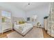 Bright bedroom with light walls and plantation shutters at 3360 Founders Club Dr, Sarasota, FL 34240