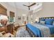 Serene bedroom with hardwood floors, and ceiling fan at 3360 Founders Club Dr, Sarasota, FL 34240