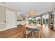 Bright dining area with a round table and chairs, next to a kitchen and living room at 3360 Founders Club Dr, Sarasota, FL 34240