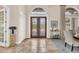 Grand entryway with double doors and tile flooring at 3360 Founders Club Dr, Sarasota, FL 34240