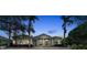 Grand home with brick driveway and landscaping at 3360 Founders Club Dr, Sarasota, FL 34240