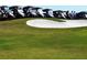 Golf carts parked on a hill overlooking a sand trap at 3360 Founders Club Dr, Sarasota, FL 34240