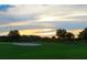 Sunset view over a green golf course at 3360 Founders Club Dr, Sarasota, FL 34240