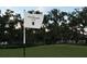 View of flag on green with 'The Founders Club' text and trees at 3360 Founders Club Dr, Sarasota, FL 34240