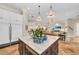 Bright kitchen with large island, pendant lighting, and stainless steel appliances at 3360 Founders Club Dr, Sarasota, FL 34240