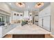 Modern kitchen with white cabinetry, center island, and high-end stainless steel appliances at 3360 Founders Club Dr, Sarasota, FL 34240