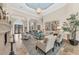 Elegant living area featuring high ceilings and a fireplace at 3360 Founders Club Dr, Sarasota, FL 34240