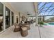 Elegant outdoor dining area near the pool at 3360 Founders Club Dr, Sarasota, FL 34240