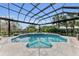 Inviting screened pool with spa and well-maintained landscaping, offering a tranquil retreat at 3360 Founders Club Dr, Sarasota, FL 34240