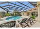 Inviting pool and spa with covered lanai at 3360 Founders Club Dr, Sarasota, FL 34240