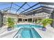 Resort-style pool and spa with covered patio at 3360 Founders Club Dr, Sarasota, FL 34240