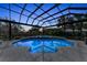 An in-ground pool with a caged pool enclosure at 3360 Founders Club Dr, Sarasota, FL 34240