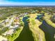 Bird's-eye view of house near golf course and lake at 3520 Wilderness W Blvd, Parrish, FL 34219