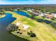 Home location shown from above near golf course and lake at 3520 Wilderness W Blvd, Parrish, FL 34219