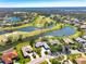 Aerial view of home on golf course with water features at 3520 Wilderness W Blvd, Parrish, FL 34219