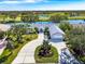 Luxury home on golf course with circular driveway and lake view at 3520 Wilderness W Blvd, Parrish, FL 34219