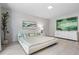 Bright bedroom with a large bed, modern decor, and a white dresser at 3520 Wilderness W Blvd, Parrish, FL 34219