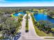 Gated entrance to community with palm trees and fountain at 3520 Wilderness W Blvd, Parrish, FL 34219