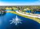 Aerial view of community with lake and fountain at 3520 Wilderness W Blvd, Parrish, FL 34219