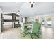 Modern dining room with round table and six sage green chairs at 3520 Wilderness W Blvd, Parrish, FL 34219