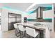 Modern kitchen with white cabinets, stainless steel appliances, and marble countertops at 3520 Wilderness W Blvd, Parrish, FL 34219