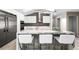 Modern kitchen with white cabinets and a large marble island at 3520 Wilderness W Blvd, Parrish, FL 34219