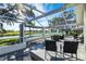 Screened patio overlooking a pond with comfortable seating at 3520 Wilderness W Blvd, Parrish, FL 34219