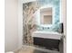 Modern powder room with floating vanity and unique onyx wall at 3520 Wilderness W Blvd, Parrish, FL 34219