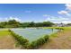 Two attractive tennis courts nestled within a landscaped area at 3520 Wilderness W Blvd, Parrish, FL 34219