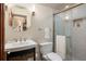 Bathroom with a modern sink and faucet, mirror, toilet, towel rack, and glass-enclosed shower at 380 Gulf Of Mexico Dr # 536, Longboat Key, FL 34228